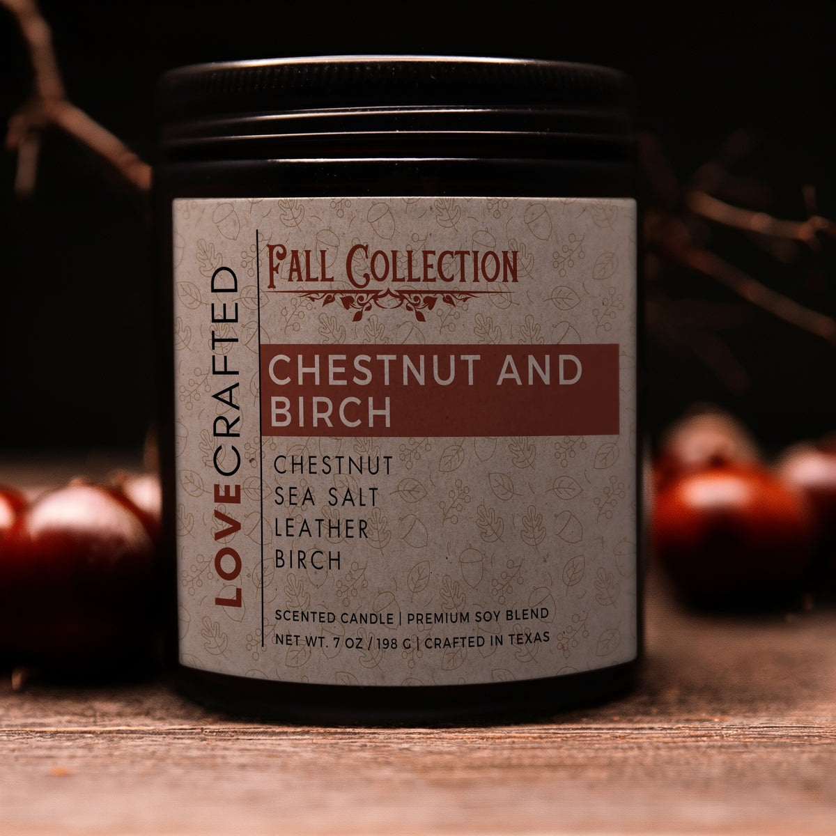 Chestnut and Birch 7oz soy blend candle in amber jar with chestnuts and birch branches