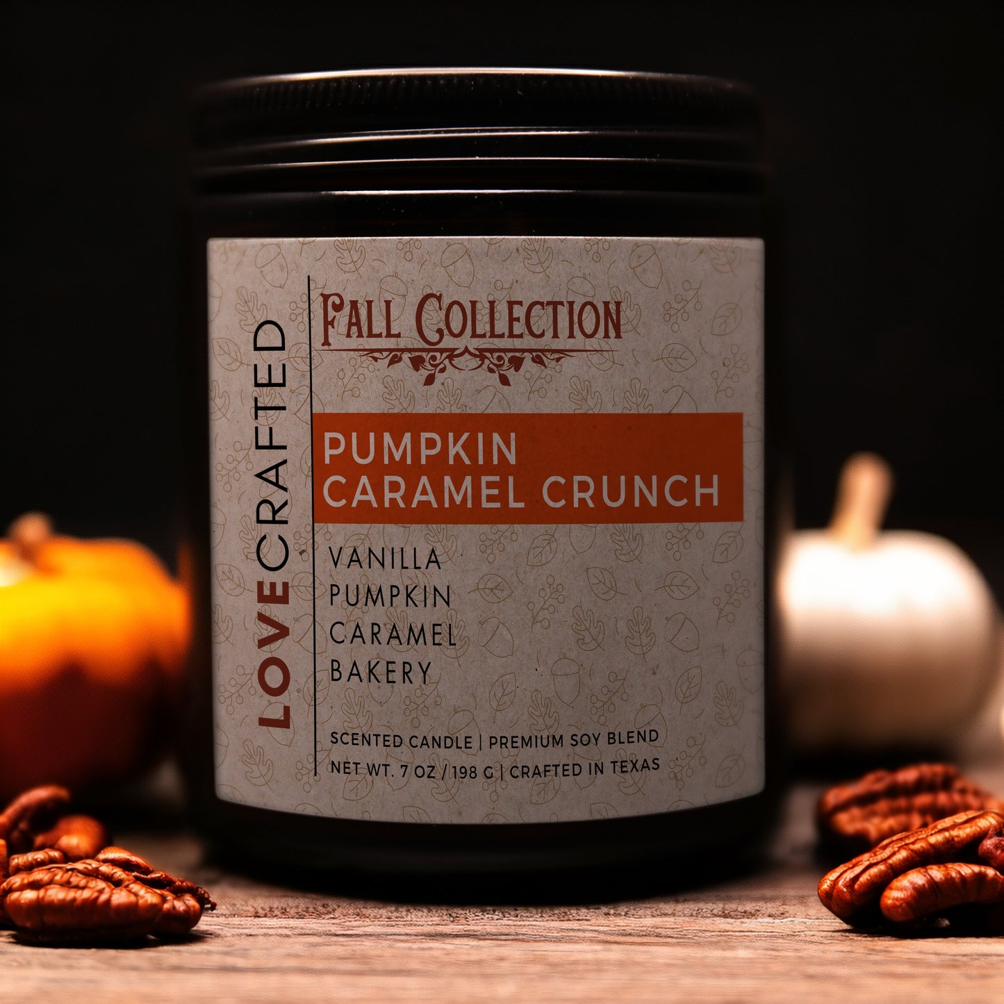 Pumpkin Caramel Crunch 7oz soy blend candle in amber jar with mini pumpkins and pecans